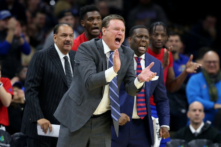 Bill Self of Kansas cheers his team on during the game against Villanova at the Wells Fargo Center on Dec. 21.