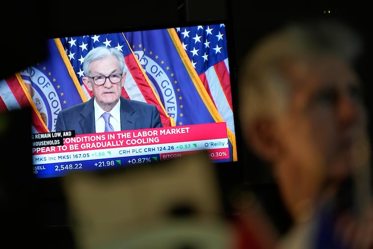 A TV displays a news conference with Fed Chair Jerome Powell on the floor at the New York Stock Exchange in New York on Wednesday after he announced the latest rate cut.