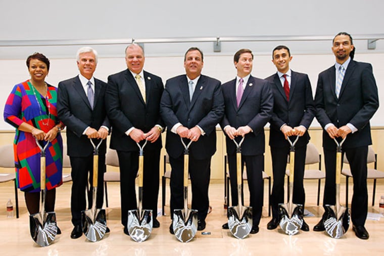 From left, Camden Mayor Dana Redd, Goerge E. Norcross, III, Chairman, Board of Trustees, NJ Senate President Steve Sweeney, Governor Chris Christie, NJ Senator Donald Norcross, Superintendant of Schools Paymon Rouhanifard, and KIPP Executive Director Drew Martin at the groundbreaking ceremony for the KIPP Cooper Norcross Academy, held at Cooper Medical School of Rowan University on Wednesday, March 5, 2014. ( MICHAEL S. WIRTZ / Staff Photographer )