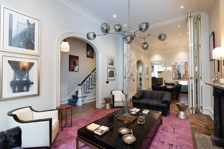 The first floor boasts 13½-foot ceilings and 10½-foot rounded archways over nine-foot doors. It's decorated with works by local artists.