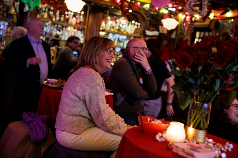 Amy and John Nardi, who met at McGillin's in 1997, at the bar during the first reunion for couples who met there.