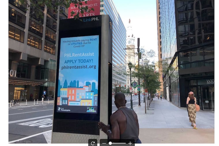 A digital sign on the 1600 block of Market St. advertising information about Philadelphia's rental assistance program.