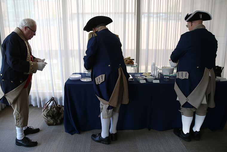 Members of the Philadelphia Continental Chapter of the Sons of the American Revolution grab a bite to eat before a preamble reading at the National Constitution Center in Philadelphia on Sept. 17, 2015. (DAVID MAIALETTI/Staff Photographer)