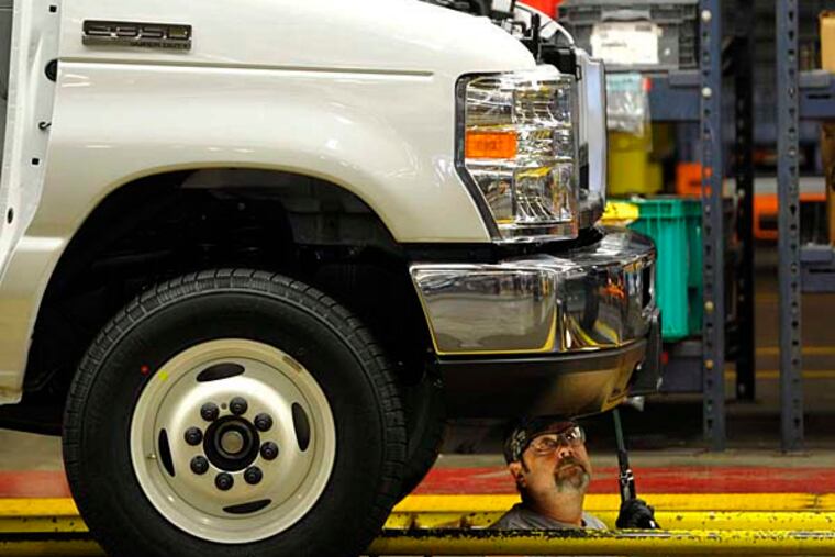 In this Aug. 12, 2015 photo, a worker works on the production line at Ford Motor Company’s Ohio Assembly Plant in Avon Lake, Ohio. Major automakers report sales figures for August on Tuesday, Sept. 1, 2015. (AP Photo/David Richard)