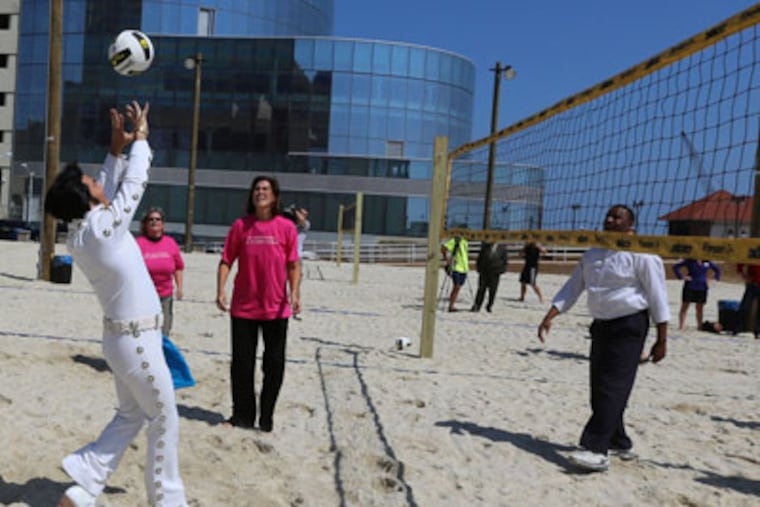 Atlantic City. NJ The Casino Reinvestment Development Authority ( CRDA) and Atlantic City Alliance (ACA) took part in announcing construction of 7 tournament style volleyball courts at New Jersey Ave at the Boardwalk in Atlantic City Nj on Friday Sept 7, 2012.Kevin Mills " Elvis" impersonator sets the ball in action in the 1st match. Photo: Tom Briglia
Atlantic City. NJ The Casino Reinvestment Development Authority (CRDA) and Atlantic City Alliance (ACA) took part in announcing construction of 7 tournament style volleyball courts located at New Jersey Ave at the Boardwalk in Atlantic City NJ. on Sept 7, 2012 Photo: Tom Briglia