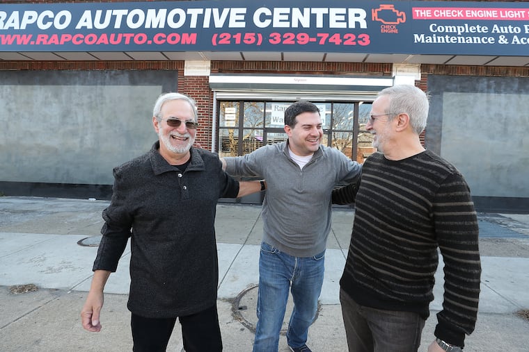 Bruce Goldstein, left, Jason Goldstein, center, and Michael Goldstein, right, pose for a portrait outside their shop, Rapco Automotive Center, in Philadelphia, PA on November 21, 2019. They renovated the exterior of the shop. The work was part of the City of Philadelphia’s program called the "Storefront Improvement Program.”
