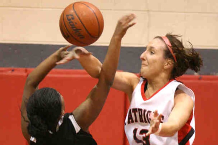 Freire's Taryn Vinson has her shot blocked by Germantown Academy's Alexa Gallagher in the first quarter. Gallagher led the Patriots with 18 points. Vinson scored six.