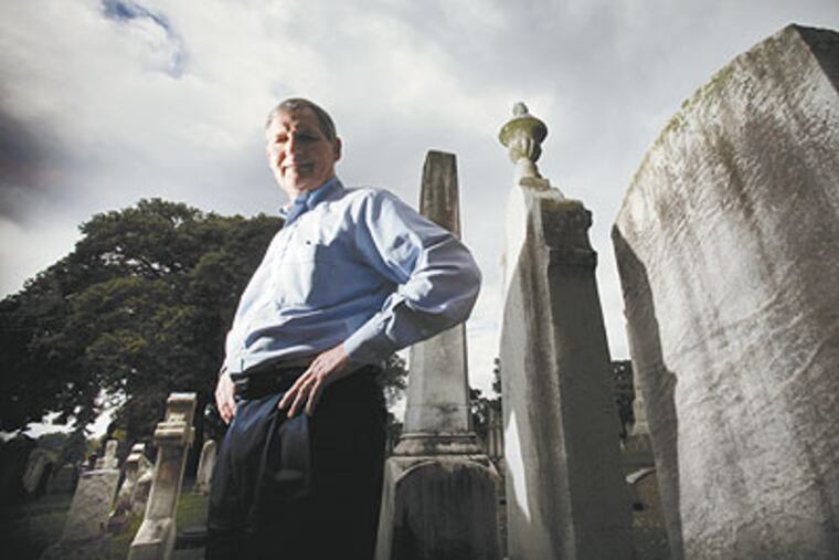 Among the graves at Laurel Hill Cemetery is CEO Pete Hoskins. But his main concern is for left-behind animals, including those at the zoo, which he ran for years. (Laurence Kesterson / Staff Photographer)