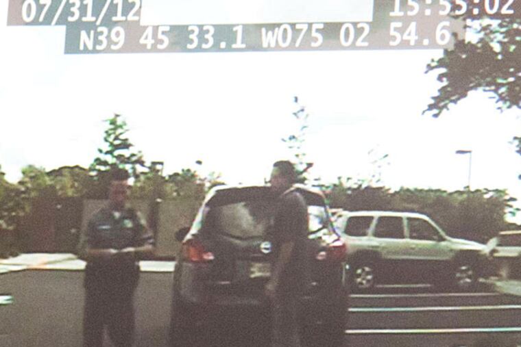 A still from police footage of Assemblyman Paul Moriarty's alleged false arrest. Officer Joseph DiBuonaventura is on the left.