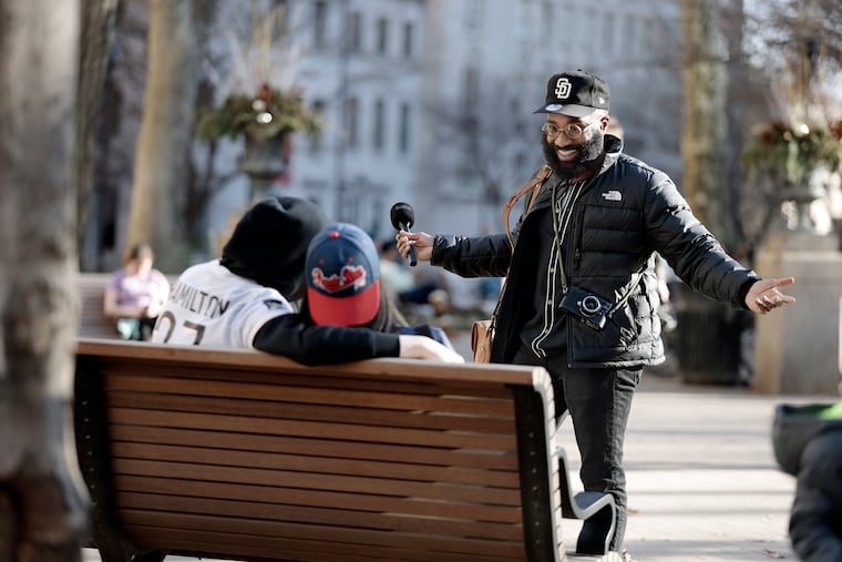 Photographer Anthony Page looks for people to interview in Rittenhouse Square in Philadelphia.