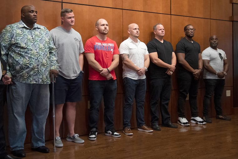 From left: Police Officers Nathaniel Harper, Michael Guinter, Shaun Parker, Justin Matthews, Ryan Waltman, James Wheeler, Edward Wright are honored by family and friends at FOP Headquarters in Northeast Philadelphia on Thursday, Aug. 29, 2019.