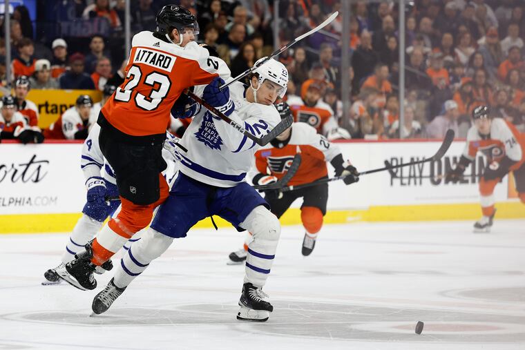 Flyers defenseman Ronnie Attard checks Toronto Maple Leafs left wing Matthew Knies.