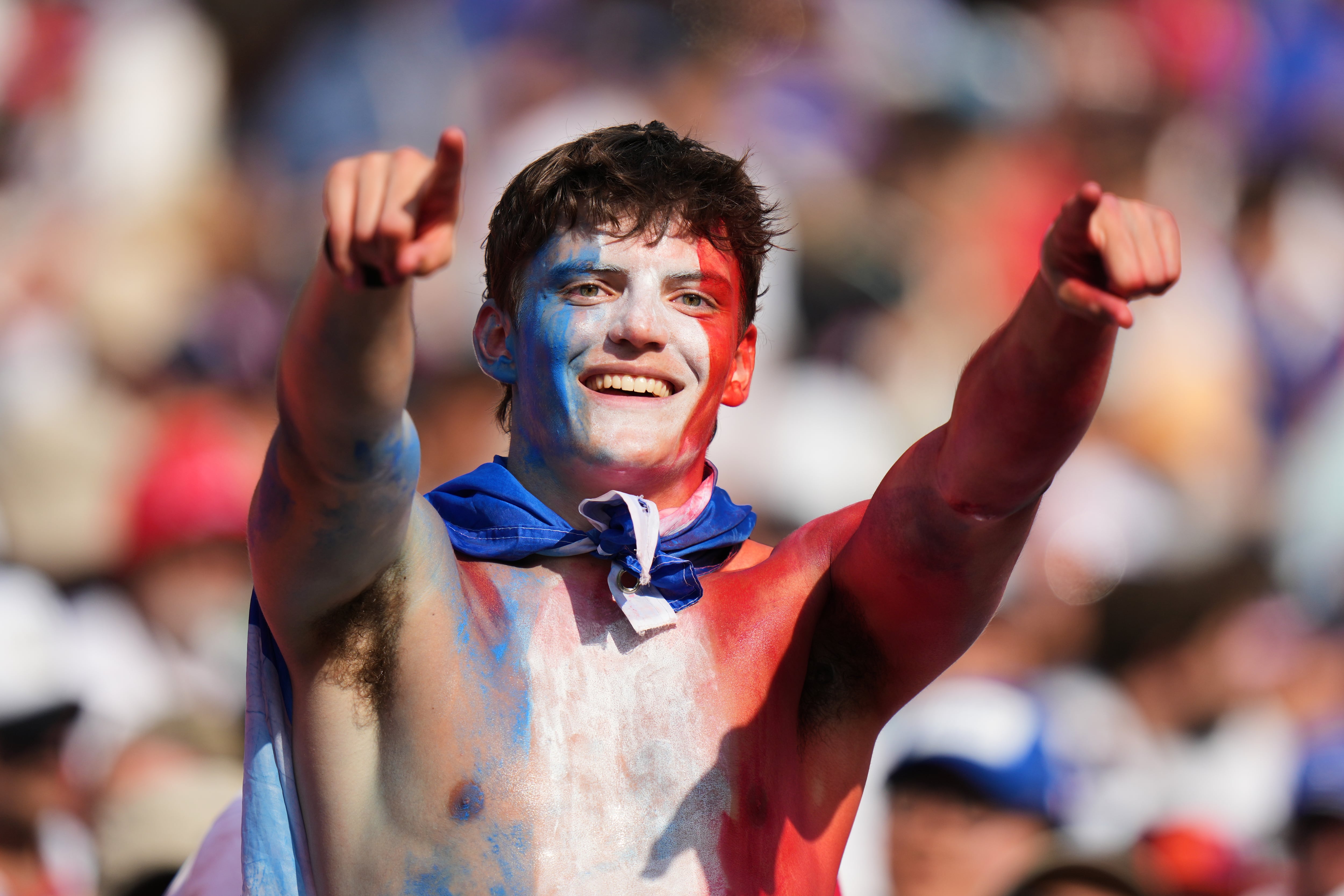 World Cup fans flood stadiums and fan zones with dazzling costumes, facepaint and flags — in photos