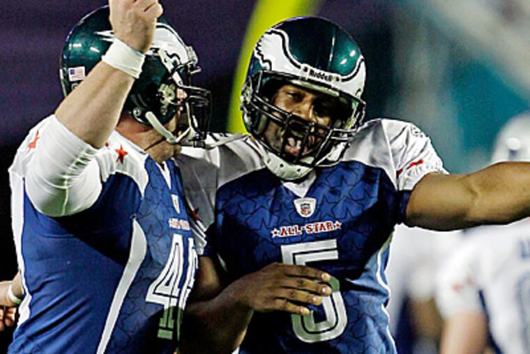 Philadelphia Eagles quarterback Donovan McNabb (5) and Jon Dorenbos celebrate during last weekend's Pro Bowl. (AP Photo/David J. Phillip)