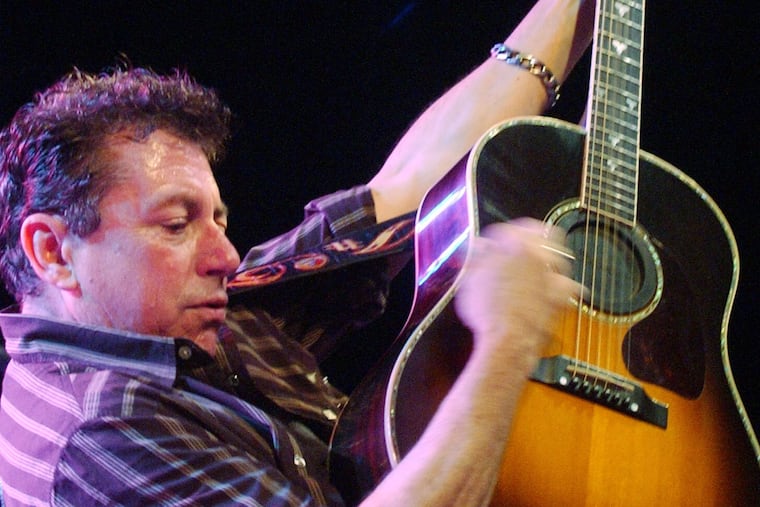 FILE - Joe Ely performs during the "Tsunami Relief — Austin to South Asia" concert at the Austin Music Hall in Austin, Texas Sunday, Jan. 9, 2005. (AP Photo/Kelly West, file)