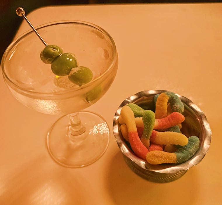 The Girl Dinner cocktail, a clarified gin martini with a sidecar of gummy worms, at Angeloni's Club Madrid in Atlantic City, N.J.