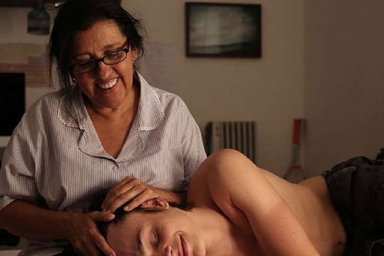 Regina Casé is housekeeper to a family that includes Michel Joelsas as the son. (ALINE ARRUDA / Oscilloscope)