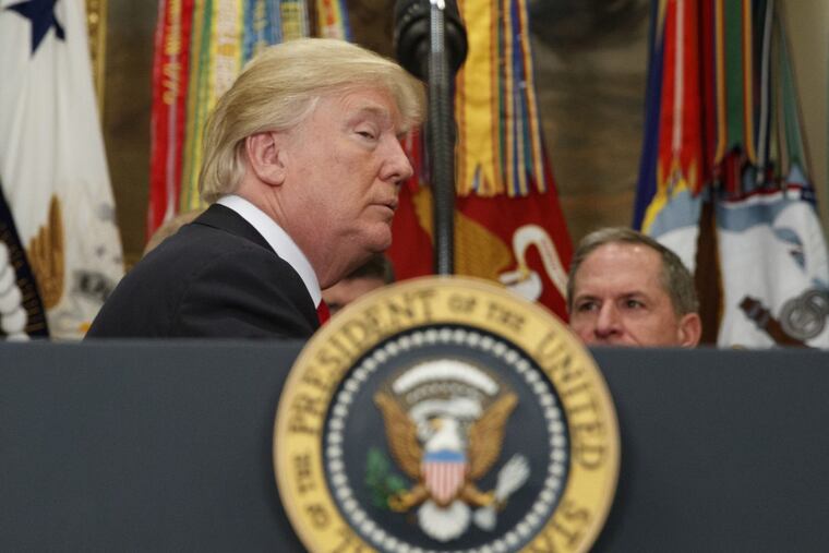 President Donald Trump listens to a question as he leaves a signing ceremony for the National Defense Authorization Act for Fiscal Year 2018, in the Roosevelt Room of the White House, Tuesday, Dec. 12, 2017, in Washington.