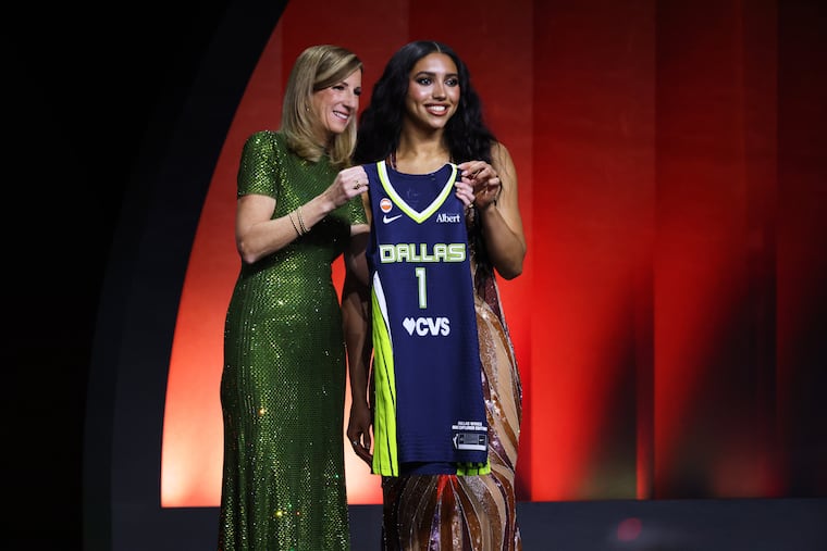 UConn guard Azzi Fudd (right) poses with WNBA commissioner Cathy Engelbert after being selected first overall by the Dallas Wings in the WNBA draft on Monday.