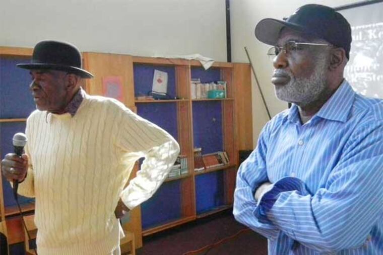 Meldorn Shamlin (left) and Kenneth "Freedom Smitty" Salaam, talk to people gathered at the Cecil B. Moore Branch of the Free Library of Philadelphia about the time they spent protesting to desegregate Girard College. The protest was led by the late Cecil B. Moore, a charismatic and controversial president of the NAACP. (Valerie Russ / Staff)
