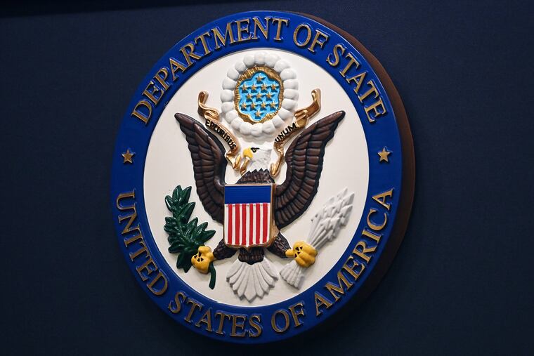 The State Department seal is seen on the briefing room lectern at the State Department in Washington, Jan. 31, 2022. Everyday Americans will be able to help refugees adjust to life in the U.S. in a program being launched by the State Department. The goal is to give private citizens a role in resettling the thousands of refugees who come to America every year. The State Department is calling the new program the Welcome Corps.