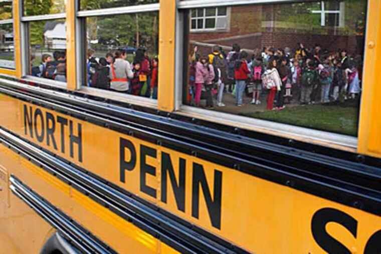 File: Students lined up outside York Ave. Elementary School in Lansdale are reflected in windows of school bus in this 2010 photo. (Tom Gralish / Staff Photographer)