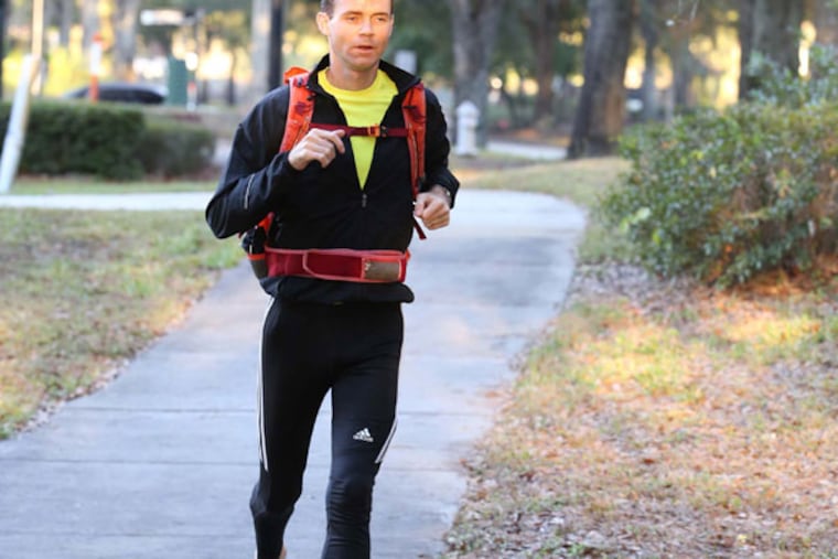 Mike Funk runs barefoot daily from his home in Altamonte Springs to his job in Maitland, Florida, December 19, 2012. (George Skene/Orlando Sentinel/MCT)
