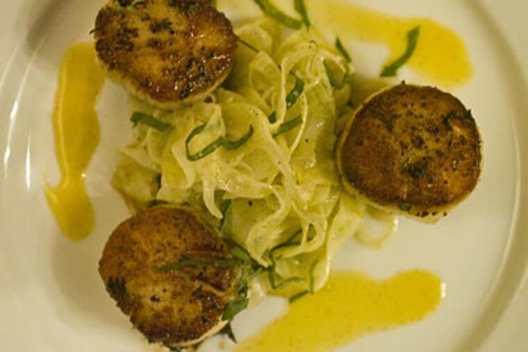 The appetizer of seared scallops served with fennel shreds in a vanilla-orange vinaigrette. (RON TARVER / Staff Phtoographer)