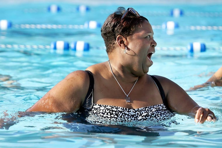 Donna DeShazo (front) at the O’Connor pool. A scary incident as a child had kept her out of the water for decades.