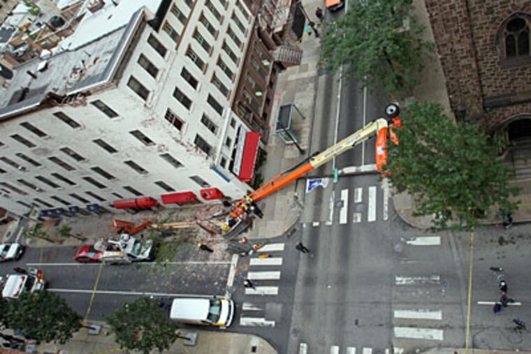 A mobile crane working on a church steeple toppled near Rittenhouse
Square on Monday. (Steven M. Falk / Staff Photographer)