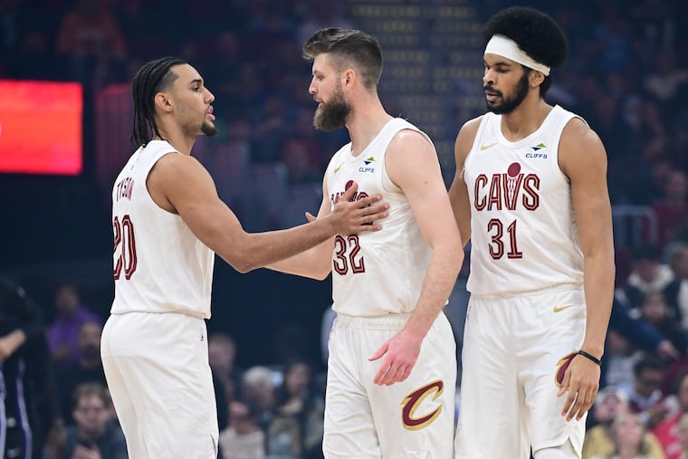 Cleveland Cavaliers guard Jaylon Tyson (left) is congratulated by forward Dean Wade (center) and center Jarrett Allen (right). Wade is heading to Philly on a four-year deal.