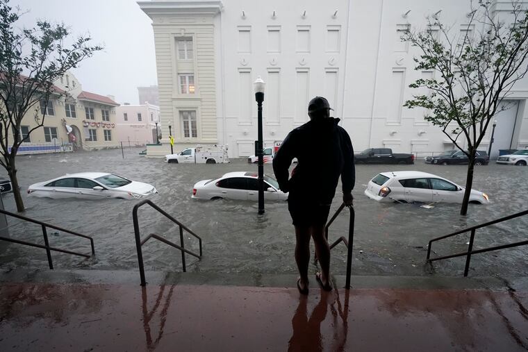 Floodwaters move on the street, Wednesday, Sept. 16, 2020, in Pensacola, Fla. The Census Bureau is contending with several natural disasters as wildfires and hurricanes disrupt the final weeks of the nation’s once-a-decade headcount.