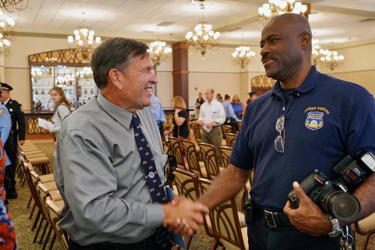 Lt. William Schatzle (left) talks with Police Officer Halley Spencer following a merit commendation ceremony Wednesday, Sept. 21, 2016.