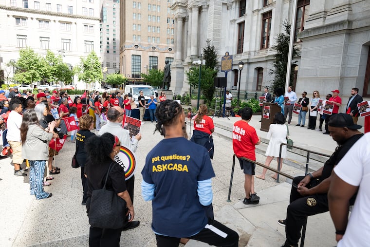 Teachers, school leaders, education advocates, and community members gather outside City Hall to protest Philadelphia School District budget cuts.
