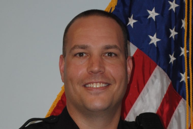 Cpl. Michael Pitcher, 40, has been charged with unlawful use of a computer, terroristic threats and harassment.