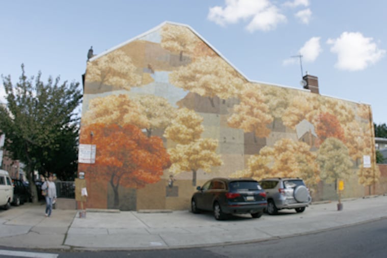 Community members and supporters say David Guinn's mural, "Autumn," has been an economic boom in Bella Vista. (Ashlee Espinal / Staff Photographer)