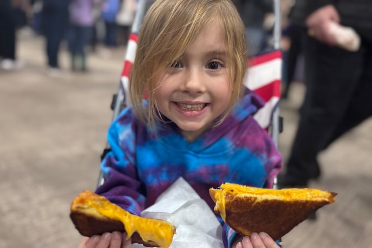 Penelope Nark, the author's daughter, enjoyed a grilled cheese offered by the PA Dairymen's Association.