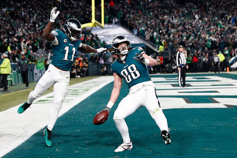 Eagles tight end Dallas Goedert (88) celebrates his third-quarter touchdown with receiver A.J. Brown during the playoff win against the Packers on Jan. 12.