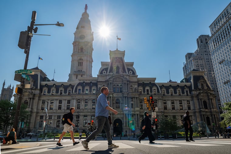 Center City pedestrians brave strong sun on a hot day in late July. This is on track to be one of the warmer summers on record.