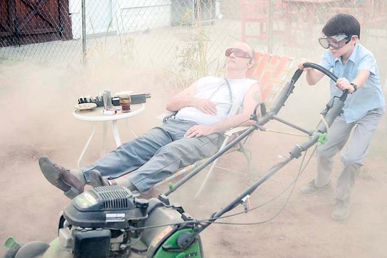 (L-R) BILL MURRAY and JAEDEN LIEBERHER star in ST. VINCENT. Maggie (Melissa McCarthy), a single mother, moves into a new home in Brooklyn with her 12-year old son, Oliver (Jaeden Lieberher). She leaves Oliver in the care of neighbor Vincent (Bill Murray), a retired curmudgeon with a penchant for alcohol and gambling. Together with a pregnant stripper named Daka (Naomi Watts), Vincent brings Oliver along on all the stops that make up his daily routine. © 2014 The Weinstein Company. All rights reserved. Photographer: Atsushi Nishijima