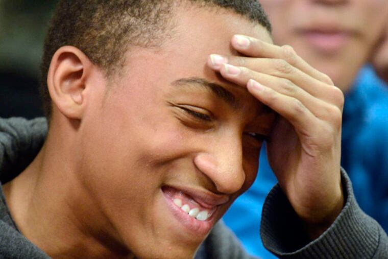 Academy at Palumbo freshman Emmanuel Williams and sophomore Ming Wu (in background) talk about their team's winning the Samsung contest - worth $140,000 in new technology. (Tom Gralish / Staff Photographer)