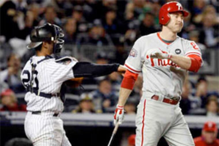 Chase Utley and the Phillies strike out in their bid to repeat as world champions. The Yankees won, 7-3, to claim their 27th title. (Ron Cortes / Staff Photographer)