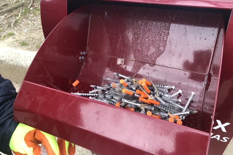 The city has installed numerous sharp boxes to collect used needles. One box sits right outside McPherson Square Park.