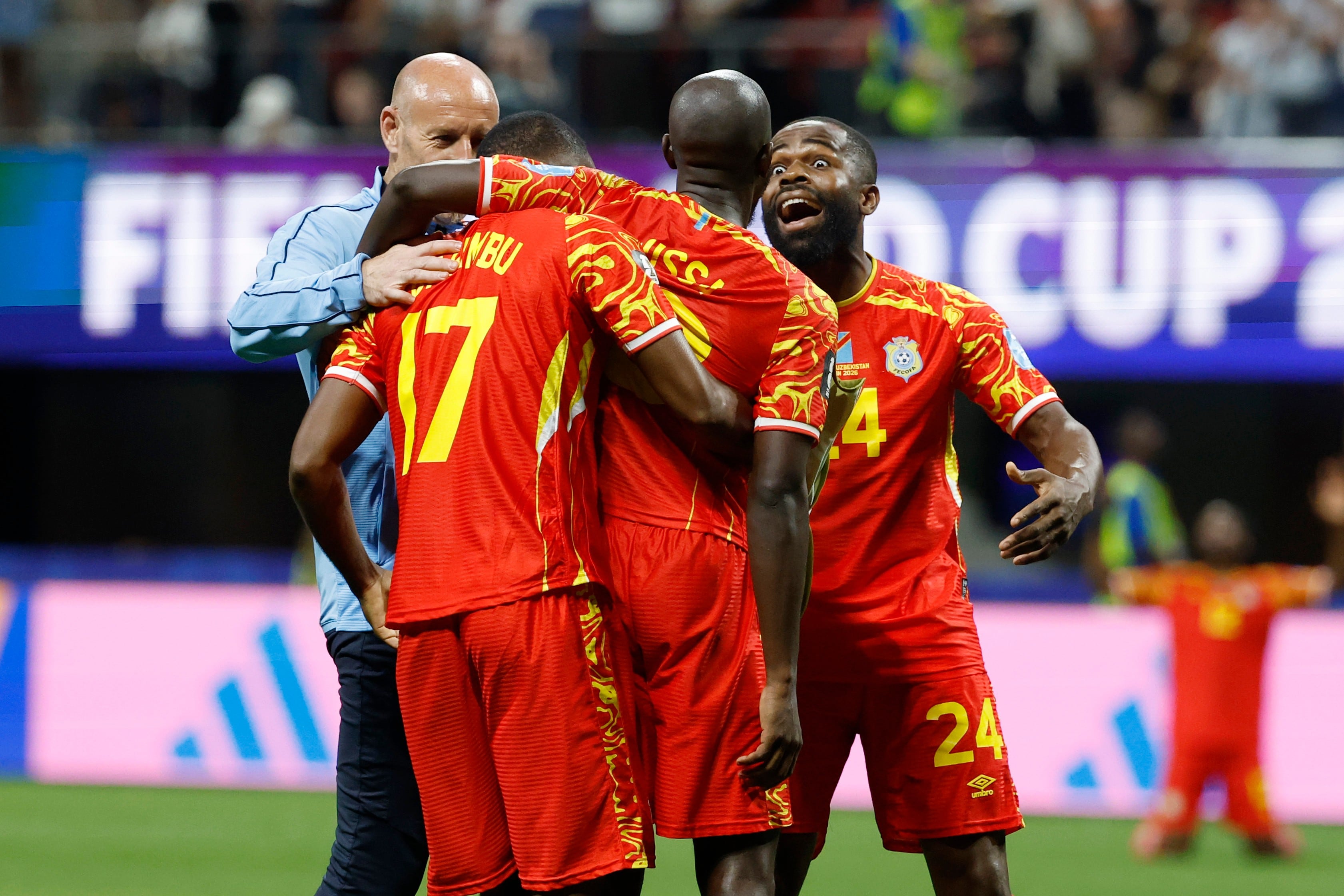Congo rallies to a 3-1 win against Uzbekistan to seal place in the World Cup knockouts