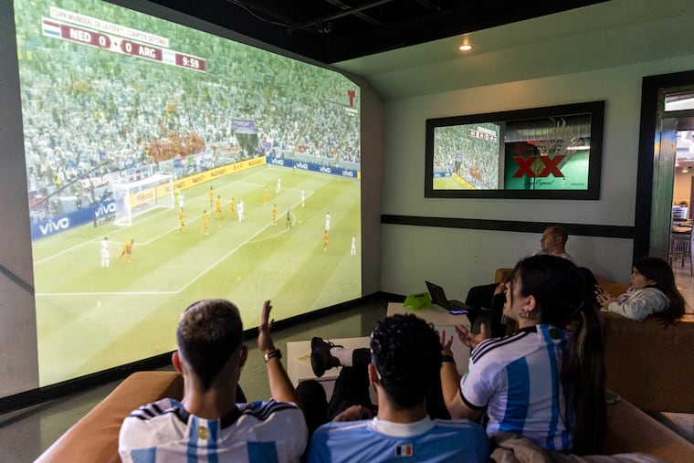 Fans cheer on Argentina as it faces the Netherlands in the World Cup at Dimension Sports Bar in Philadelphia, Pa., on Dec. 9, 2022.