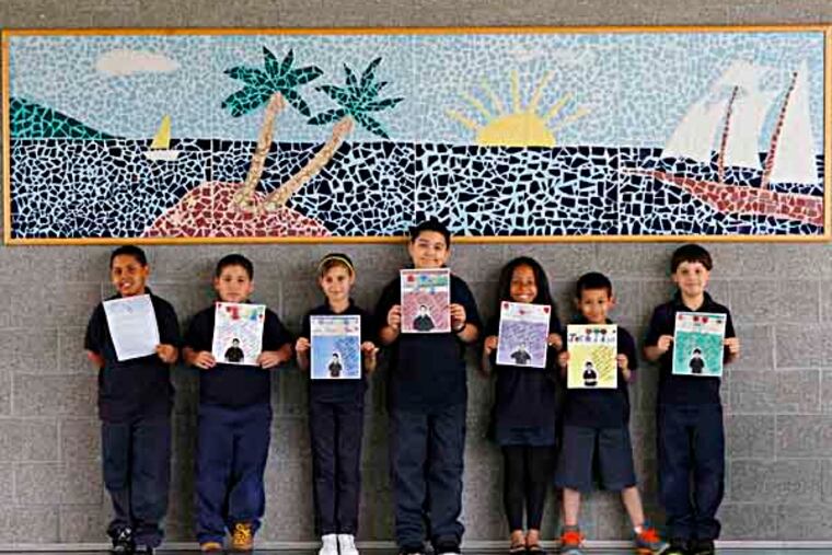 From left, Raul Ortiz, Ryan Llanos, Camila Solivah, Ismael Rivera, Damaris Davis, Justin Rivera, and Jacob Davil, students in Hillary Linardopoulos' third grade class at Julia de Burgos Elementary, hold the letters that they wrote to Vice President Joe Biden. Biden answered some of their letters in his audio series. ( MICHAEL S. WIRTZ / STAFF PHOTOGRAPHER ). May 17, 2013.