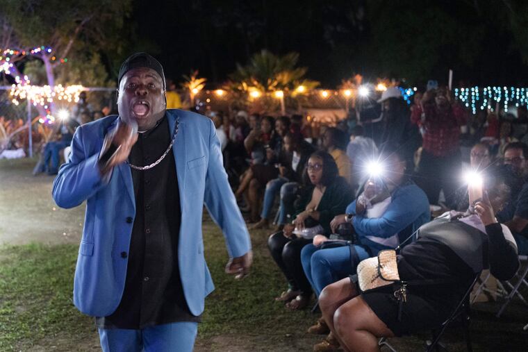 Bishop Lawrence Rolle performs in front of children and adults at Mt. Carmel Preparatory Academy in Nassau, Bahamas in December. Rolle's ministry received $50,000 from FTX in early 2022, one of several donations the cryptocurrency exchange made to the Bahamian people when it relocated to the Caribbean island nation in 2021.