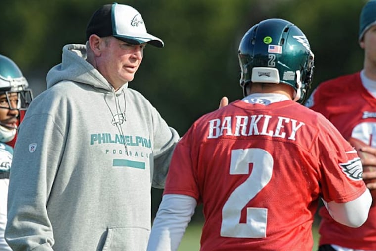 Eagles quarterbacks coach Bill Musgrave during passing drills at practice Dec. 4, 2014 with quarterbacks Matt Barkley and Nick Foles. (Clem Murray/Staff Photographer)