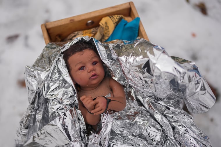 A depiction of the baby Jesus — zip-tied and wearing a space blanket — adorns the Nativity scene outside of the Lake Street Church of Evanston, in Evanston, Ill., earlier this month.