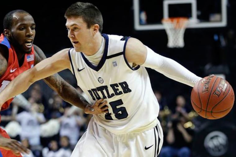 Butler's Rotnei Clarke, right, drives against Dayton's Kevin Dillard during the first half of an NCAA college basketball game at the Atlantic 10 Conference tournament in New York, Thursday, March 14, 2013. (Seth Wenig/AP)
